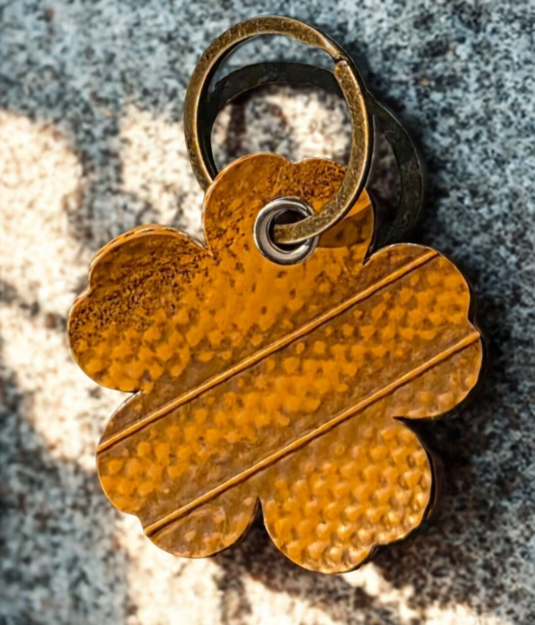Flower-shaped keyring is made from genuine recycled fire hose